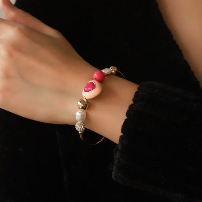 Traje de pulsera combinado con perlas de melocotón y corazón, diseño Original de moda